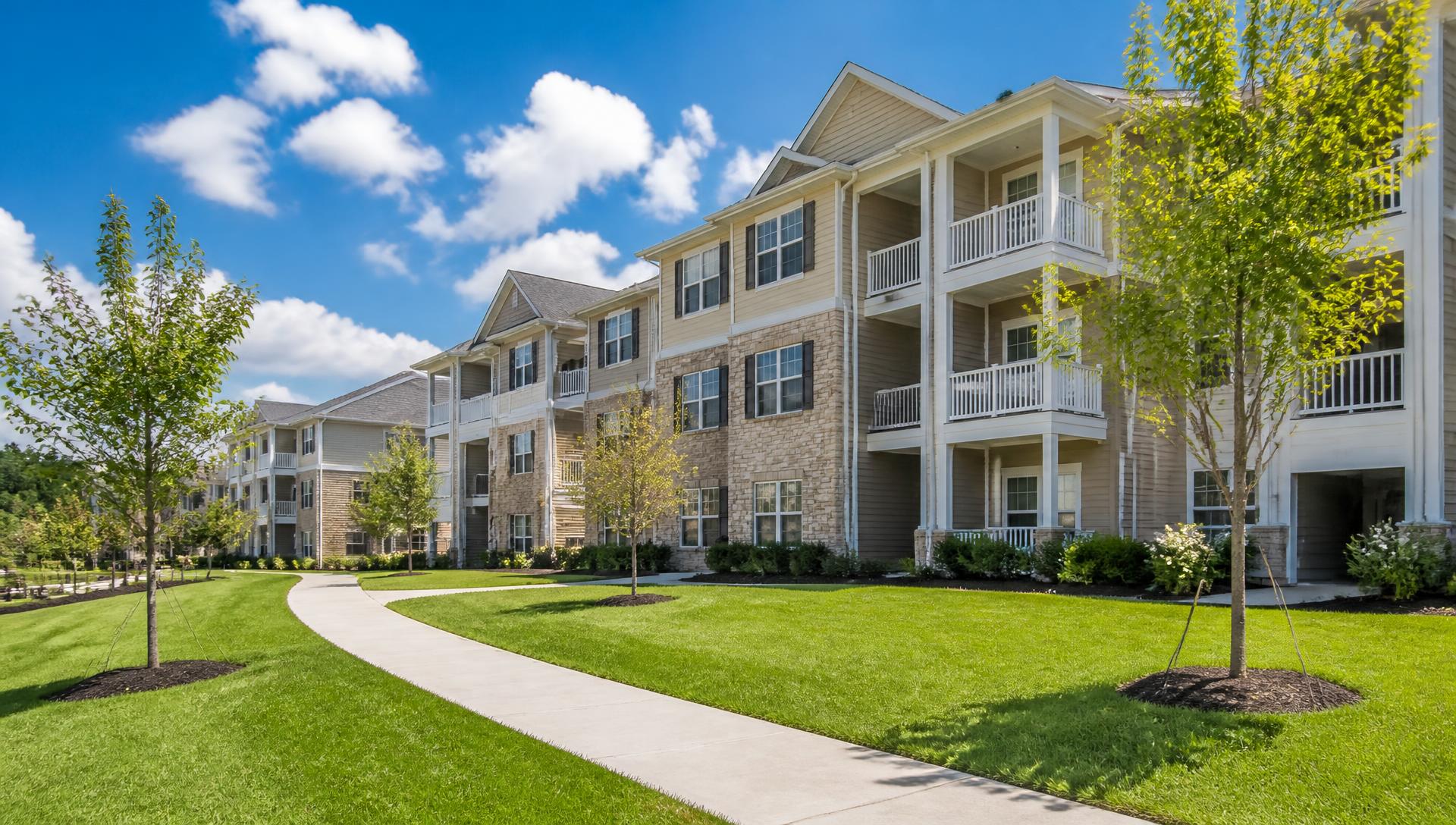 Modern multi-family apartment building with ground-floor retail managed by Elevated Property Solutions